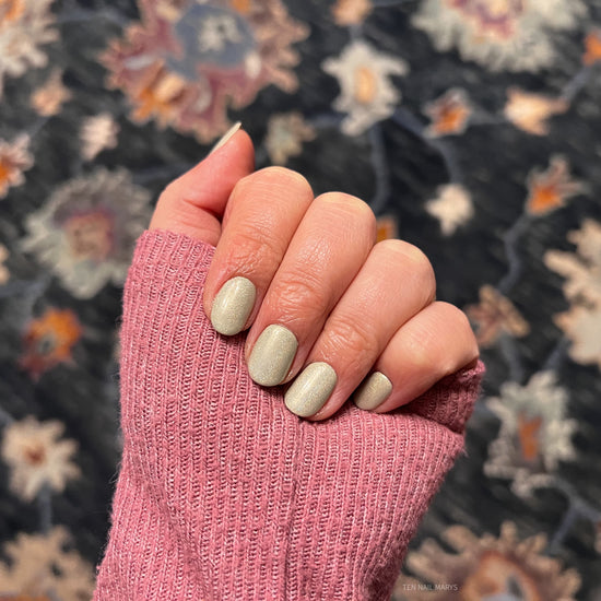 holographic top coat with beige nail polish