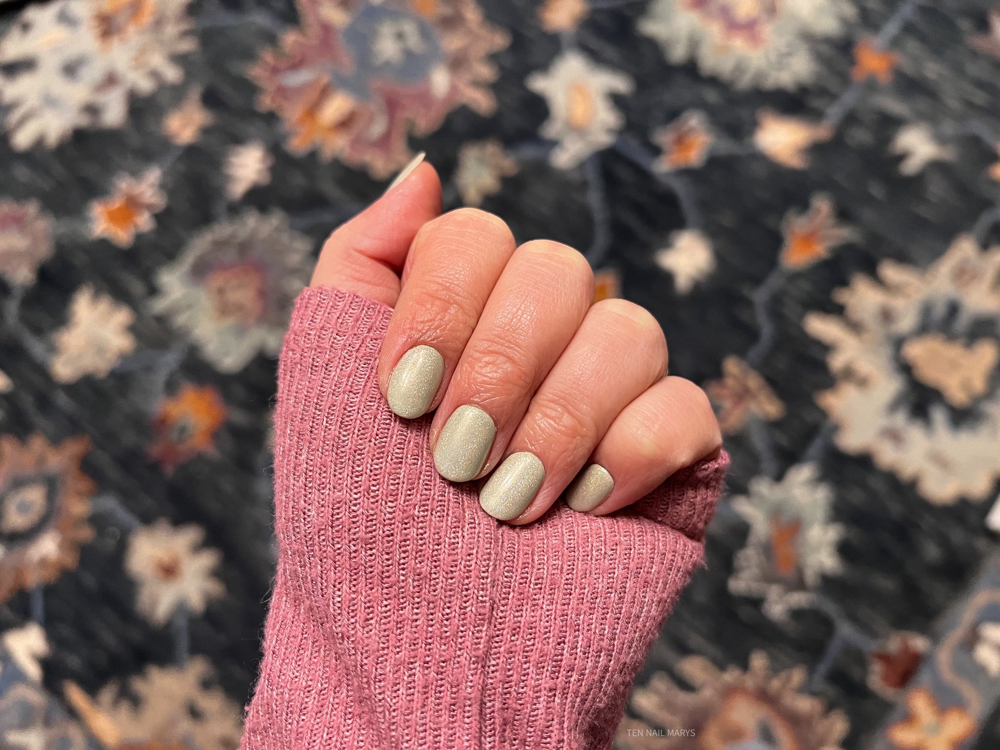 holographic top coat with beige nail polish