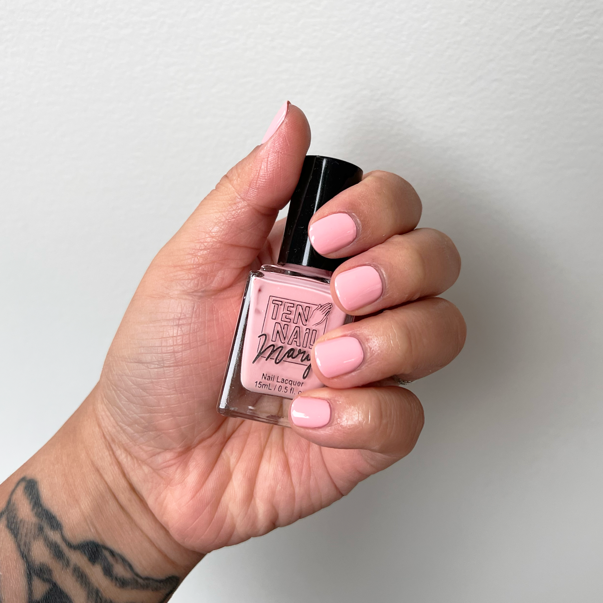 Prickly Pear painted on fingernails with tattooed arm